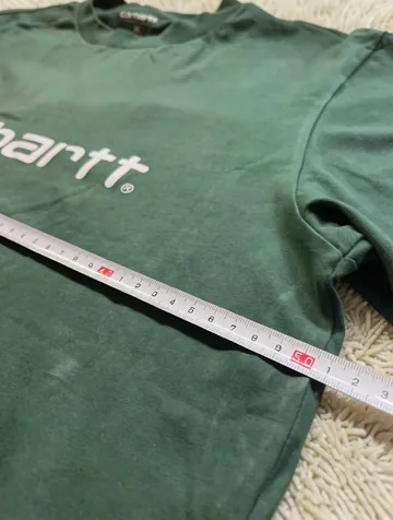 The tape measure across the width of the item